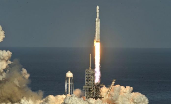 A SpaceX Falcon Heavy rocket lifts off from the Kennedy Space Center in Cape Canaveral