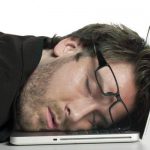 businessman sleeping on his laptop