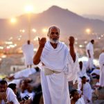 haj hec Muslim pilgrim prays atop Mount Mercy on the plains of Arafat