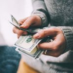 woman_holding_cash_51dollar