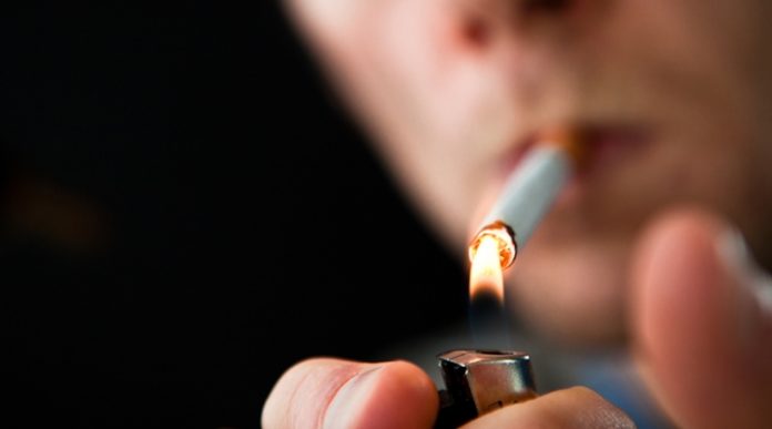 Man lighting a cigarette