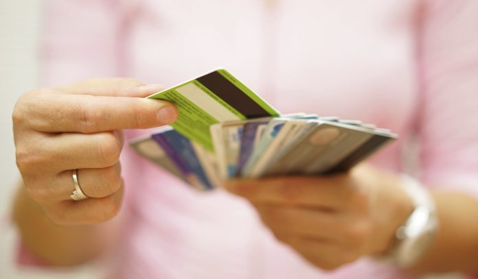 woman choose one credit card from many, concept of credit card