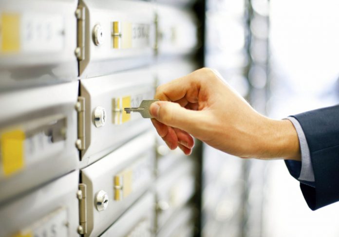 Man opening mailbox